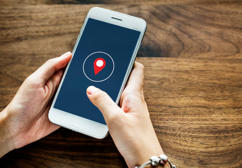Phone showing location icon illustrating how to stop phone from tracking your location