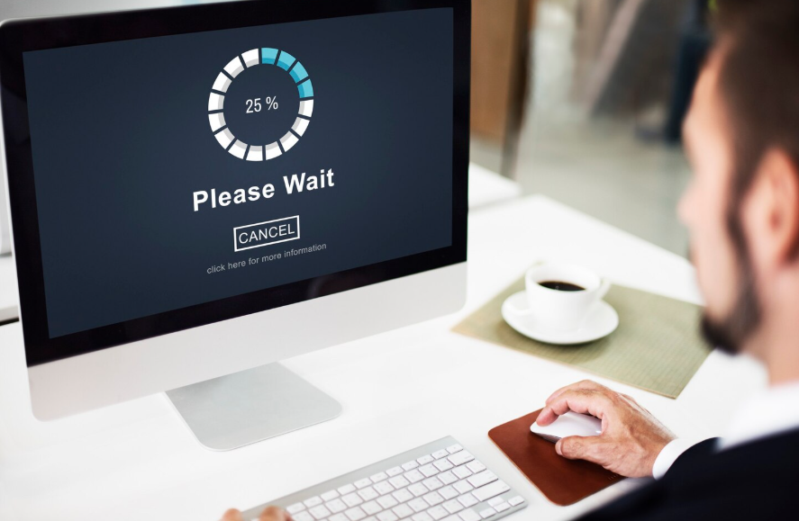 Computer screen showing loading delay while learning how to speed up a slow laptop