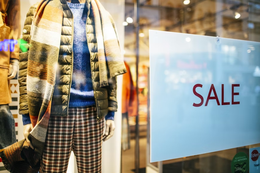 Winter clothing on sale showing how to save money buying off season