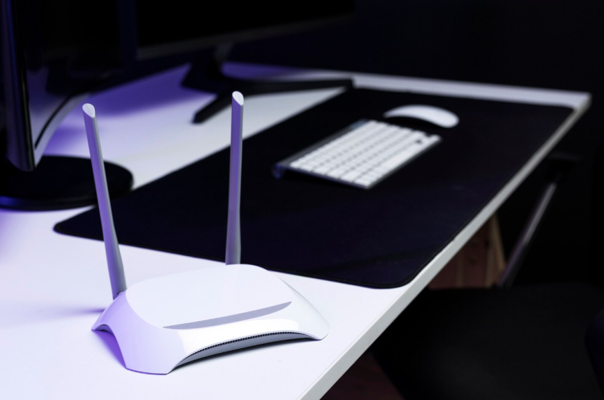 WiFi router on desk showing why you should restart your router more often