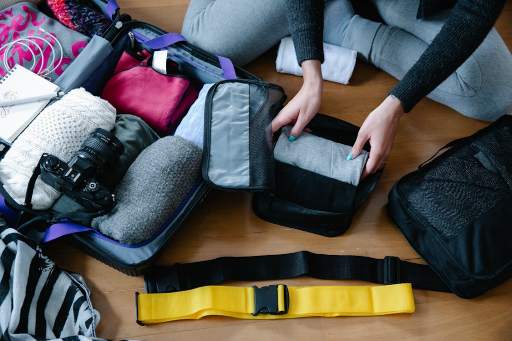 Traveler packing efficiently to show how to pack a carry-on so you use everything inside